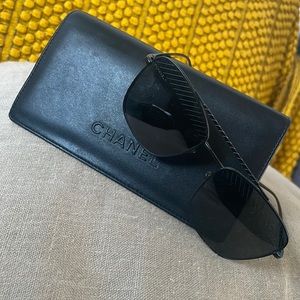 Black Pilot Chanel sunglasses for women.